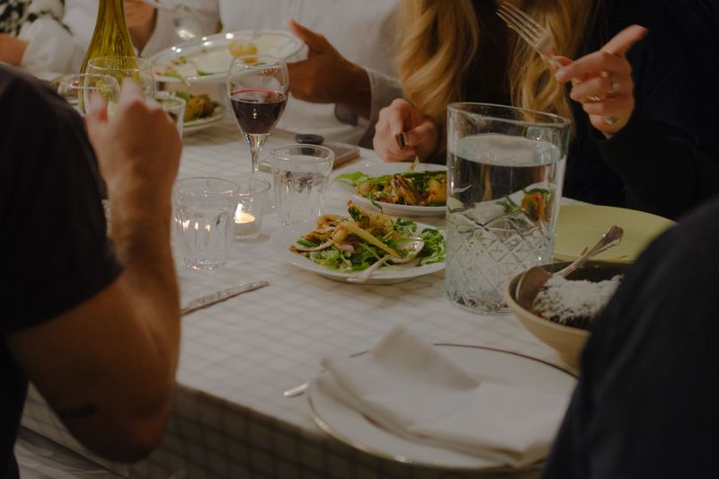 Close up table with dishes Queensrollahouse rooftop terrace